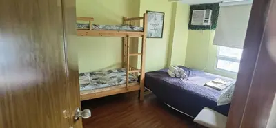 a room with two bunk beds and a bed at OYO 1172 MVM Transient House in Manila