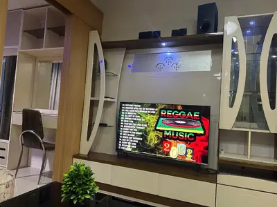 a room with a tv in a store at Wheng Place at Shell Residences MOA in Manila