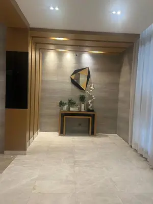 a hallway with a door and a table with plants at Good Luck House at S RESIDENCES in Manila