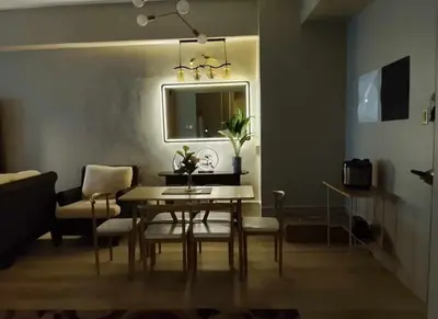 a dining room with a table and chairs at Amazing 1 5BR unit Connected to Eastwood Mall in Manila