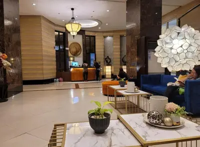 a lobby with couches and tables in a building at Amazing 1 5BR unit Connected to Eastwood Mall in Manila