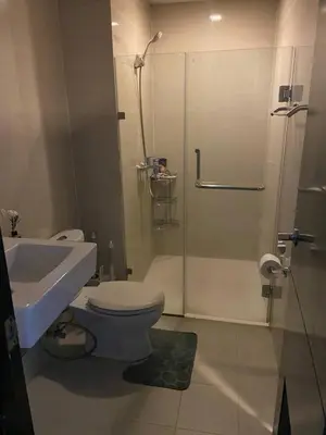 a bathroom with a toilet and a shower and a sink at Estancias De Sofielo in Manila