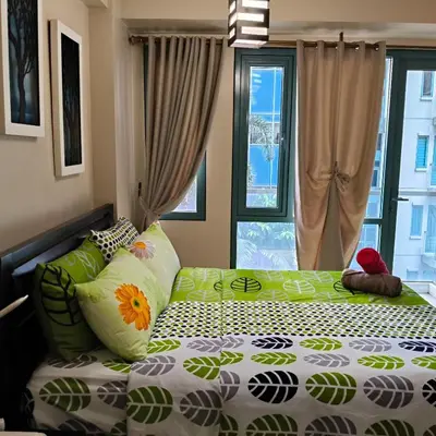 a bedroom with a bed and a window at LDN Secret Crib 3P - Two Palm in Manila