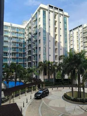 a car parked in front of a large building at LDN Secret Crib 3P - Two Palm in Manila