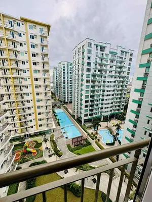 an aerial view of a city with tall buildings at Palm Beach West - Baler Tower in Manila