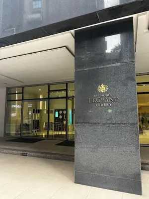 a building with a sign in front of a store at Kozy Mood Studio in Manila