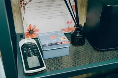 a cell phone sitting on top of a table at Budget staycation near moa in Manila