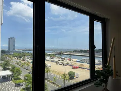 a view of a city from a window at 2BR facing Manila Bay & City View Shore 2 Residences MOA with Parking by Prime Stay in Manila