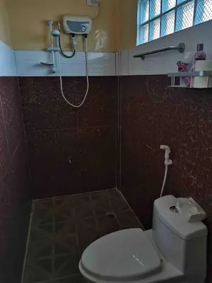 a bathroom with a toilet and a shower at Casa Ylaya - a New Private Pool Getaway in General Trias
