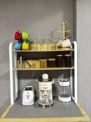a toy kitchen with a coffee maker and glasses on a shelf at H Cloud Suites Monarch Parksuites near MOA and Casino City in Manila