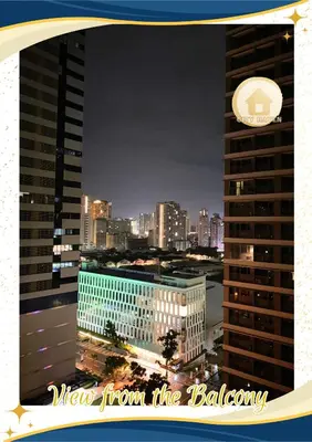 a view of a city skyline at night at Condo with Pool and Balcony near Megamall Ortigas Center in Manila
