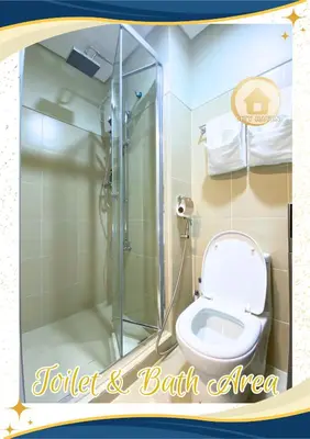 a bathroom with a toilet and a walk in shower at Condo with Pool and Balcony near Megamall Ortigas Center in Manila