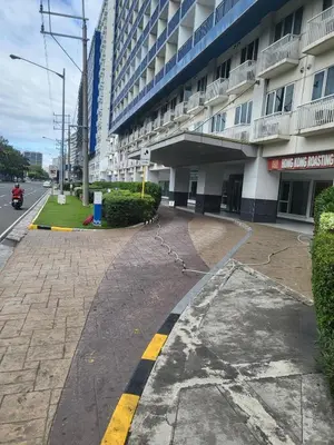 an empty street in front of a building at SeaResidence TowerA,Netflex,Wifi near MOA in Manila