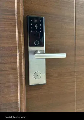 a metal door handle on a wooden door at Cozy Escape by Dave 4563 in Manila