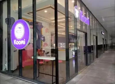 a store front window with a purple sign on it at Cozy Escape by Dave 4563 in Manila