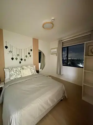 a bedroom with a white bed and a window at A and A Place - The Hive C - Free Parking in Taytay