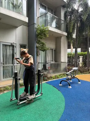 a man is riding a scooter on a treadmill at Cozy Haven Across Terminal 3 in Manila