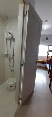 an open door to a bathroom with a sink at Dagos Studio City Filinvest Alabang in Manila