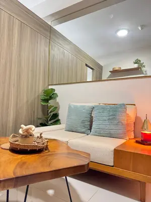 a living room with a couch and a table at Erin Serenity Harbor in Manila