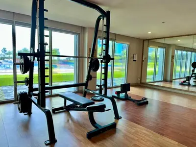 a gym with two tread machines in a room at Modern 1Bedroom Direct ManilaBay SeaView Okada Airport Spacious in Manila