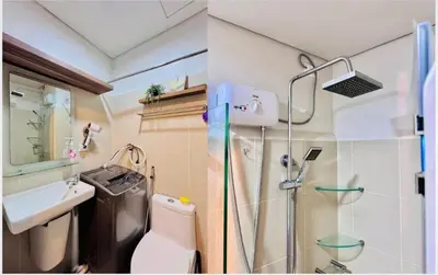 a bathroom with a shower and a toilet and a sink at Cozy 1 Bedroom near MOA in Manila