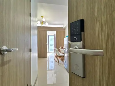 a room with a door with a microwave on it at Room 1469 Shore 2 Residences Near Airport, MOA by Prime Stay MOA in Manila