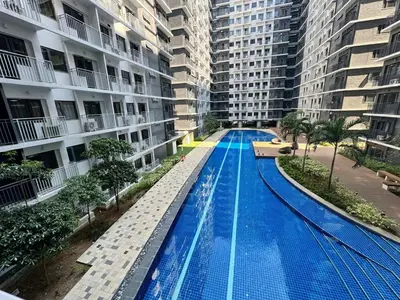 a swimming pool in the middle of a building at Shore 3 Residences Poolside Room 245 by Prime Stay MOA in Manila
