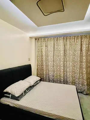 a bed in a room with a curtain at Apartment Taguig Makati staycation with parking in Manila