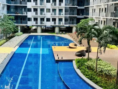 an empty swimming pool in a large building at Room 1691 Shore 3 Residences infront of SM MOA by Prime Stay in Manila