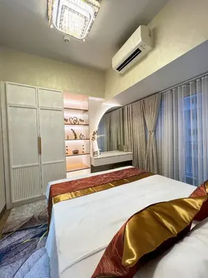 a bedroom with two beds and a window at Luxe 1BR Condo - Near BGC & Venice Grand Canal in Manila