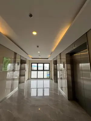 an empty hallway with glass doors in a building at Calle Homes - 1BR unit with balcony, LUSH RESIDENCES in Manila