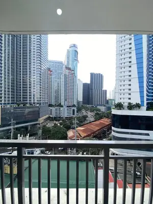 a view of a city skyline from a balcony at Calle Homes - 1BR unit with balcony, LUSH RESIDENCES in Manila