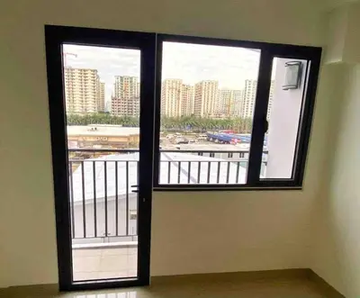 a door to a balcony with a view of a city at Mall of Asia Netflix Disney WIFI IKEA ARENA NAIA SHORE2 418 in Manila