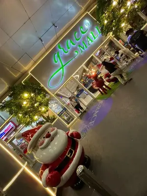 a restaurant with a hello kitty car in front of a sign at Taguig Condo Unit - Grace Residences by Jenn in Manila