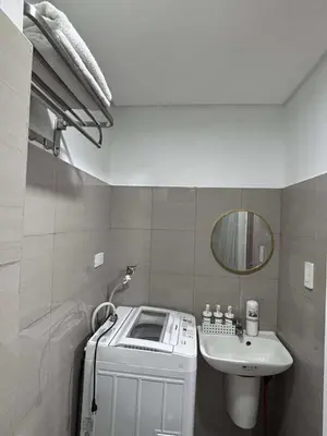 a small bathroom with a sink and a toilet at Shore 2 Tower 1 MOA MallofAsia ARENA IKEA NAIA 685 in Manila