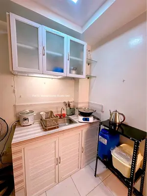 a kitchen with a sink and a counter top at Paco Manila Rental Studio Unit in Manila