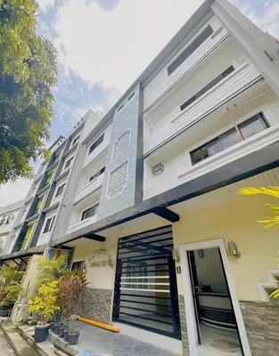 a building with a gate in front of it at Staycation in Alabang in Manila