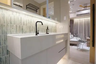 a bathroom with a sink and a mirror at Aston Residences 2BR in Pasay-up to 6pax in Manila