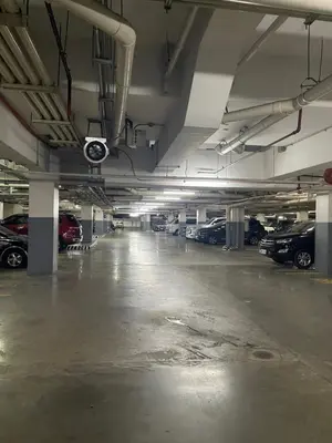an empty parking garage with cars parked in it at Casa Ocampo in Manila