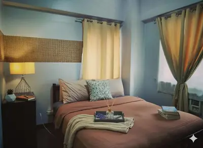 a bedroom with a bed with a tray on it at Cheap Accommodation - Newport Boulevard in Manila