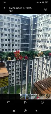a view of a large building with christmas garland at SkyShore Suites in Manila