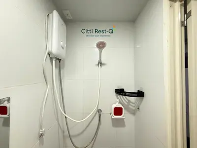 a shower in a bathroom with a gift resto sign on the wall at Studio City Alabang Pool Access Free for 2 Wifi & Netflix SC5 in Manila