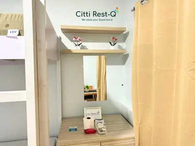 a room with a bunk bed with a wooden shelf at Studio City Alabang Pool Access Free for 2 Wifi & Netflix SC5 in Manila