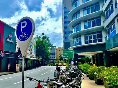 a group of motorcycles parked on the side of a street at cityscapethe39th at Eastwood Global Plaza - Luxury Residences in Manila