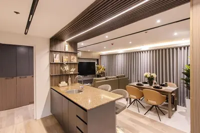a kitchen and living room with a table and chairs at cityscapethe39th at Eastwood Global Plaza - Luxury Residences in Manila