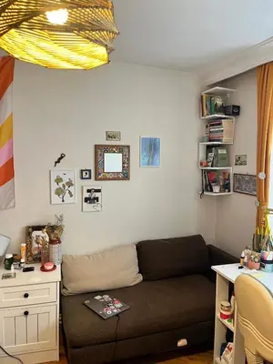 a living room with a couch and a desk at Becca's double bedroom alongside Metrobank Makati in Manila