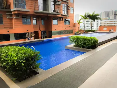 a swimming pool in the middle of a building at Dibuho Studio in Manila