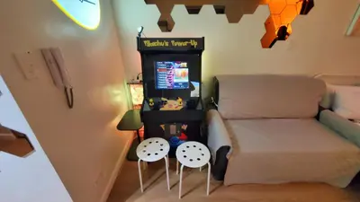 a living room with a couch and two stools at Pikamon - 15 mins to Airport - Arcade - Shore 2 - MOA in Manila