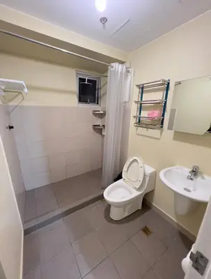 a bathroom with a toilet and a sink at Leos room in Manila
