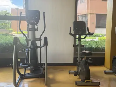 a gym with two exercise bikes in a room at Levi & Moon's Chill with beautiful view in Manila
